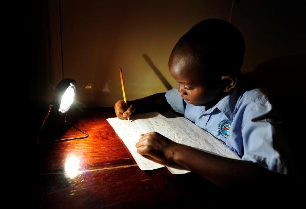 Christopher in Zambia does not have to fall back on his homework (Photo: Steve Woodward (SolarAid))