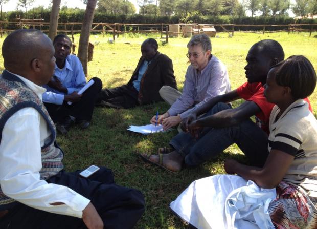 During a small group meeting, Joseph Wainaina (left) explains his part in coordinating the Peace Caravan in Eldoret (Photo: Gunilla Hamne)