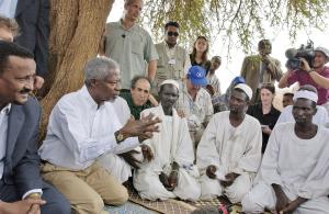 Kofi Annan (second from left), then UN Secretary-General, meets in 2004 with community leaders at the Zam Zam  Internally Displaced Persons Camp in the Darfur region of Sudan. Mohamed Sahnoun is at his left shoulder. (Photo: UN Photo/Eskinder  Debebe)