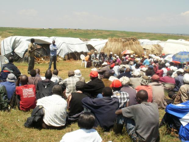 Two members of Workshop for Africa addressing displaced people in a camp in Ndaragua, Kenya 