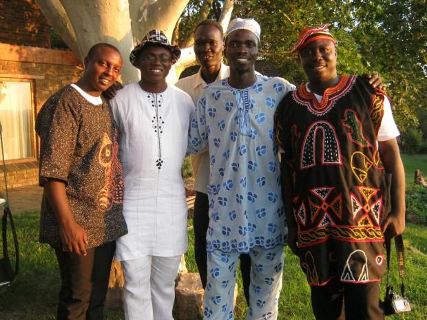 Four members of WfA during training, in their national dress.