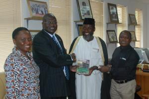 Dr Riak Machar presented with the films. Left, Mrs Dikedi-Ajakaiye (Photo: Imad Karam)