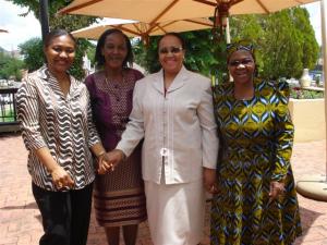 (Left) Miranda Tabifor, Gender Advisor of UNFPA and The Hon. Senator Maama shaking hands and two Lesotho MPs