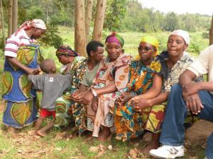 Burundian hill women listening to Daphrose
