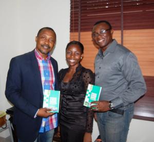 Barrister Owoseni and Victor Gotevbe pose with Nneka Onyenwe after she gave them copies of her book