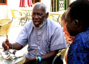 Celebrated peacebuilder Bishop Taban Paride, one of the new Committee, briefs the IofC team (Photo: Mike Brown)