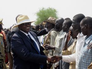 People greet the Vice President on his arrival in Walgak