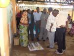 The District Commissioner (right), who fame to officially open the session, looking at the presentations of local farmers and talking with the director of the Agricultural services.