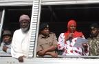 Workshop participant Aysha Dafalla reads a Peace Declaration from an open-air truck at the scene of the bomb blast in Eastleigh. Also present, from left to right, Pastor James Wuye, Imam Muhammad Ashafa, District Commissioner Omar Beja and District Commisioner George Natembeya.